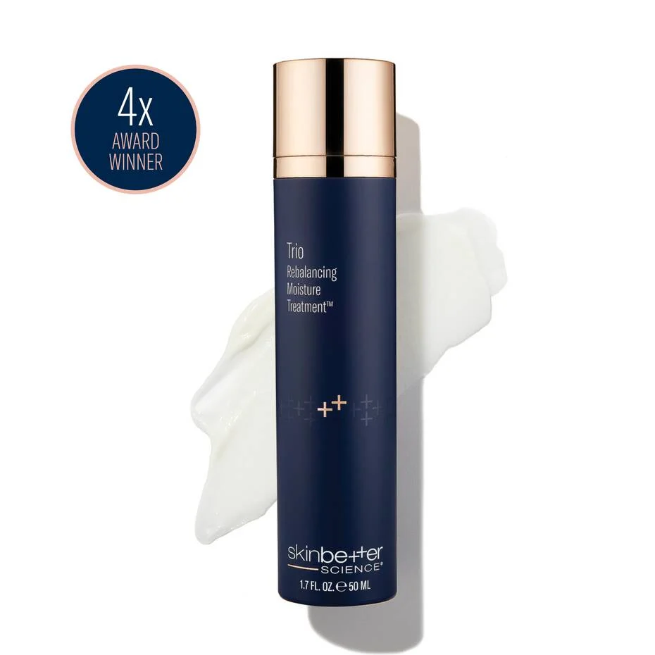 A navy skinbetter science Trio Rebalancing Moisture Treatment bottle on a white background, beside a white cream swatch and a “4x Award Winner” roundel.